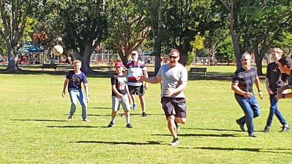 Team Members Bond with a Game of Footy Team Members Bond with a Game of Footy